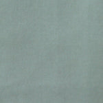 Detail of velvet fabric yardage in aquamarine.
