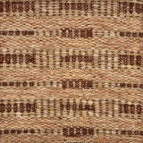 Handwoven rug sample in a abstract geometric pattern in tan and brown