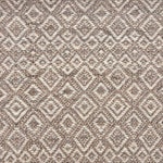 Handwoven rug sample in a radiating diamond pattern in shades of taupe and cream. 