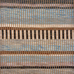 Handwoven rug sample in a mixed width stripe pattern  in light blue, brown, mauve, cream, charcoal and teal. 