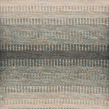 Handwoven rug sample in a subtle striped ombré pattern ranging from beige to sea green. 