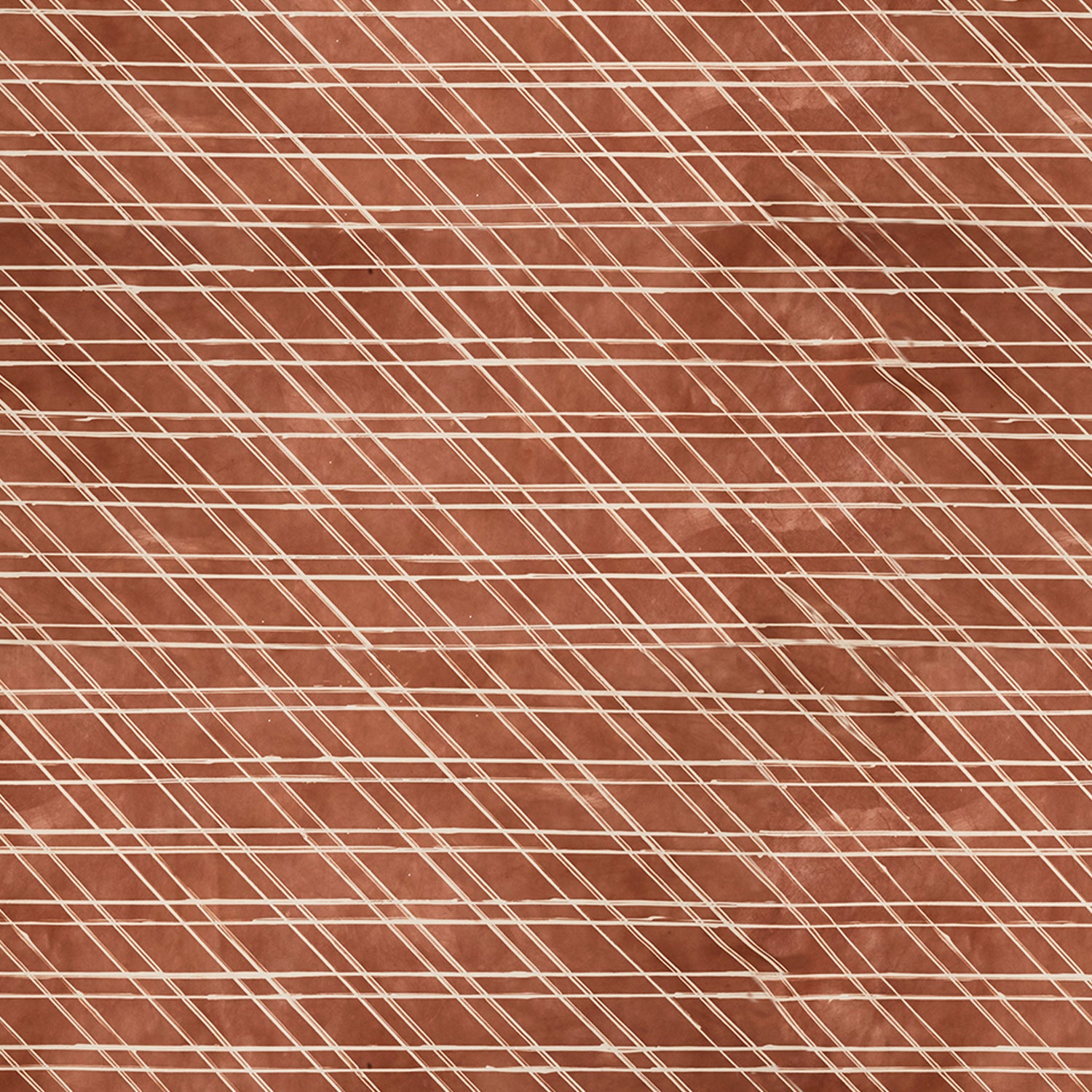 Close-up of a cowhide rug in brown with a white lattice overlay.
