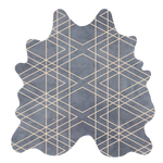 Detail of a cowhide rug in blue-gray with a tan geometric overlay.