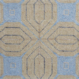 Close-up of a textured rug with geometric pattern in beige and blue