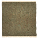 A flat weave rug sample with cream-colored fringe at top and bottom and  geometric maze-like pattern in sage green and brown. 