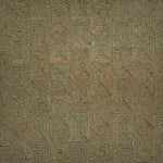 A close-up of flatweave rug  with a repeating geometric pattern in dark brown and sage green. 