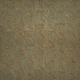 A close-up of flatweave rug  with a repeating geometric pattern in dark brown and sage green. 