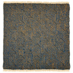 A flat weave rug sample with cream-colored fringe at top and bottom and  geometric maze-like pattern in dark blue and tan. 