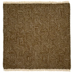 A flat weave rug sample with cream-colored fringe at top and bottom and  geometric maze-like pattern in grey and brown. 