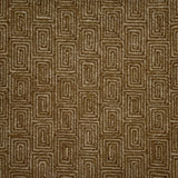 A close-up of flatweave rug  with a repeating geometric pattern in dark brown and grey. 