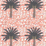 Detail of fabric in a repeating palm tree print on a mottled field in shades of brown, gray, pink and white.