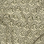 Fabric with a subtle floral pattern on a dark background