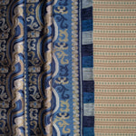 Close-up of a patterned fabric with blue and beige design