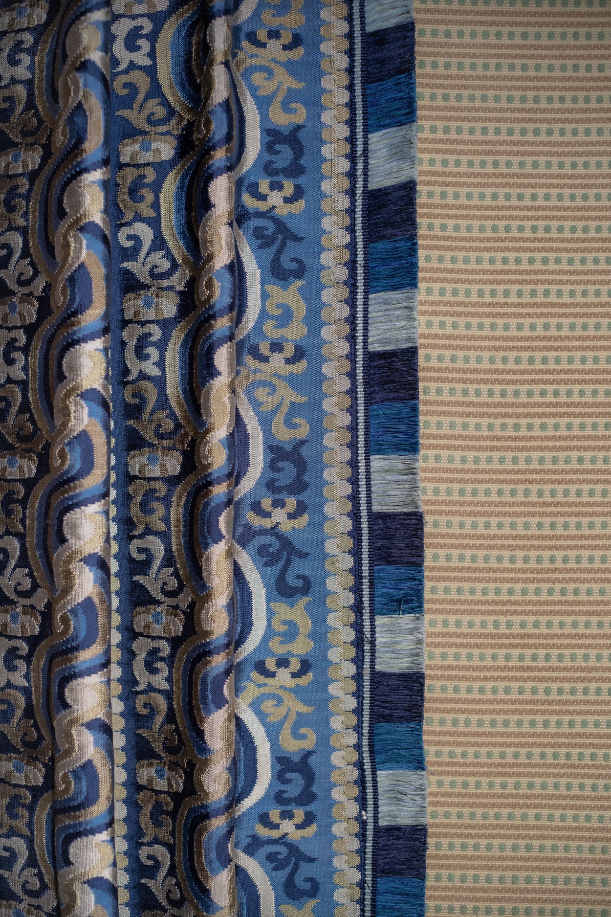 Close-up of a patterned fabric with blue and beige design