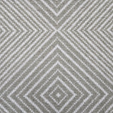Broadloom carpet sample in a linear diamond design in white and green-grey.