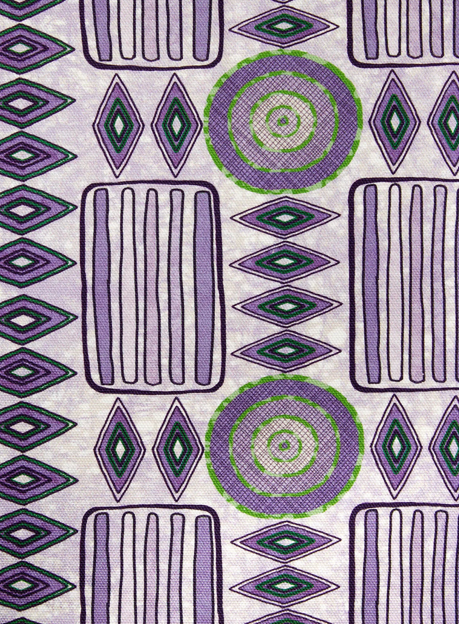 Detail of fabric in a playful geometric stripe print in shades of purple with green accents.