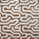 Detail of wallpaper in a playful meandering print in white on a brown field.