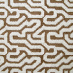 Detail of fabric in a playful meandering print in white on a brown field.
