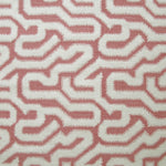 Detail of fabric in a playful meandering print in cream on a dusty rose field.