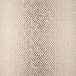 Broadloom with a geometric pattern on an ombré background in cream and taupe.