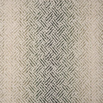 Broadloom with a geometric pattern on an ombré background in cream and emerald green.