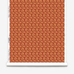 Wallpaper roll with small scale watercolor floral in red and orange.