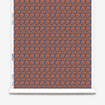 Wallpaper roll with small scale watercolor floral in blue and orange.