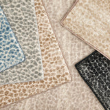 Broadloom carpet with subtle animal print in a range of colors. 