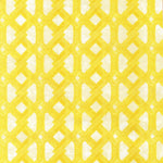 Detail of fabric in an intricate lattice print in yellow on a cream field.