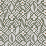 Detail of fabric in a floral damask print in white and rust on a sage field.