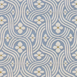 Detail of fabric in a floral damask print in white and gold on a light blue field.