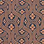Detail of fabric in a floral damask print in orange on a dark blue field.