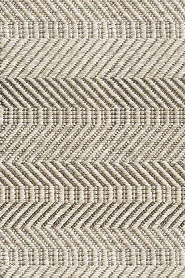 Broadloom carpet sample in a ivory, tan and taupe herringbone pattern