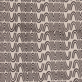 Detail of fabric in an abstract curvilinear stripe in black on a tan field.
