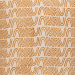 Detail of fabric in an abstract curvilinear stripe in orange on a tan field.