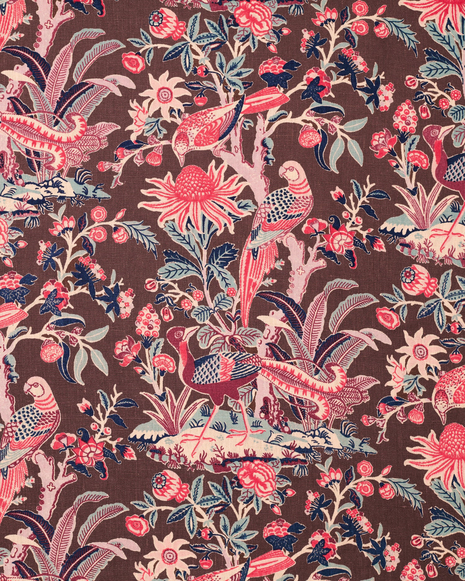 Printed fabric with a lush botanical motif with exotic birds in pink, blue and white on a brown field. 