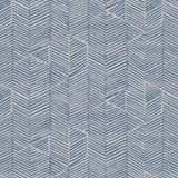 Detail of fabric in a dense herringbone print in dusty blue on a tan field.