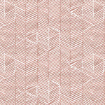Detail of fabric in a dense herringbone print in brown on a white field.