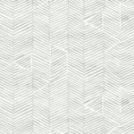 Detail of fabric in a dense herringbone print in light green on a white field.