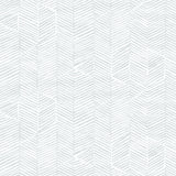 Detail of wallpaper in a dense herringbone print in light gray on a white field.