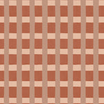 A wallpaper pattern detail in a gridded check pattern in warm pink hues. 