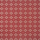 Woven fabric with ornate diamond design with cream accents on red