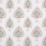 Detail of fabric in a botanical damask print in shades of pink, green and brown on a cream field.