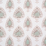 Detail of fabric in a botanical damask print in shades of pink, green and brown on a cream field.