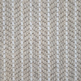 Close-up of a broadloom carpet with vertical stripes in beige and white.