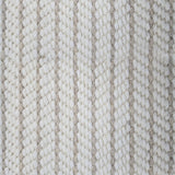 Close-up of a broadloom carpet with vertical stripes in beige and tan