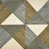 Close-up of a geometric patterned rug with triangles and stripes in green and blue.