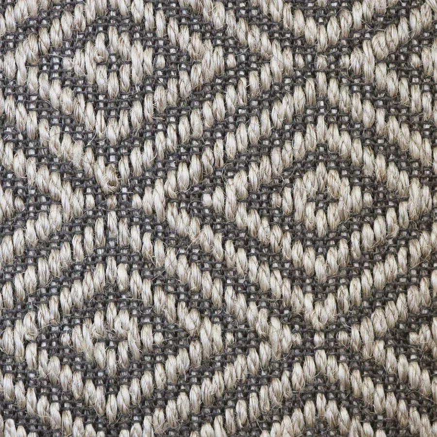 Close-up of a textured natural fibre woven diamond pattern rug in grey. 