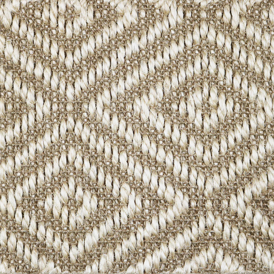 Close-up of a textured natural fibre woven diamond pattern rug in beige. 