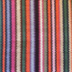 Handwoven wool striped rug in bright colors. 